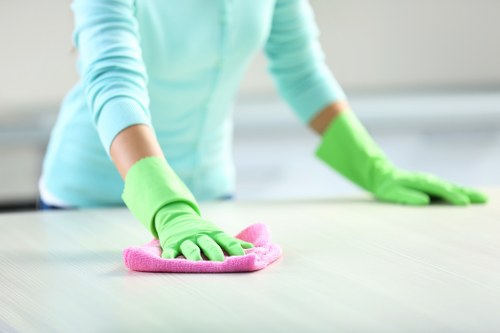 Docklands office cleaning team sanitising desks and shared office areas