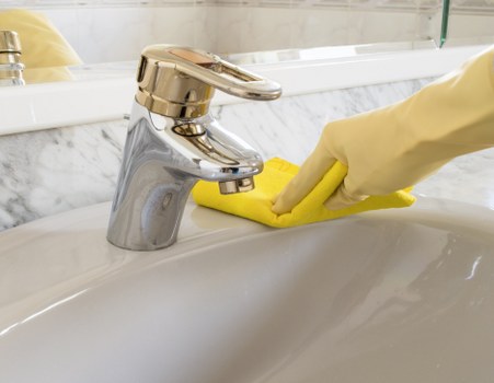 Dusting and wiping surfaces in a Docklands home